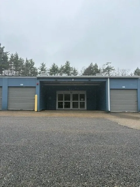 Blue building entrance with drive-up units